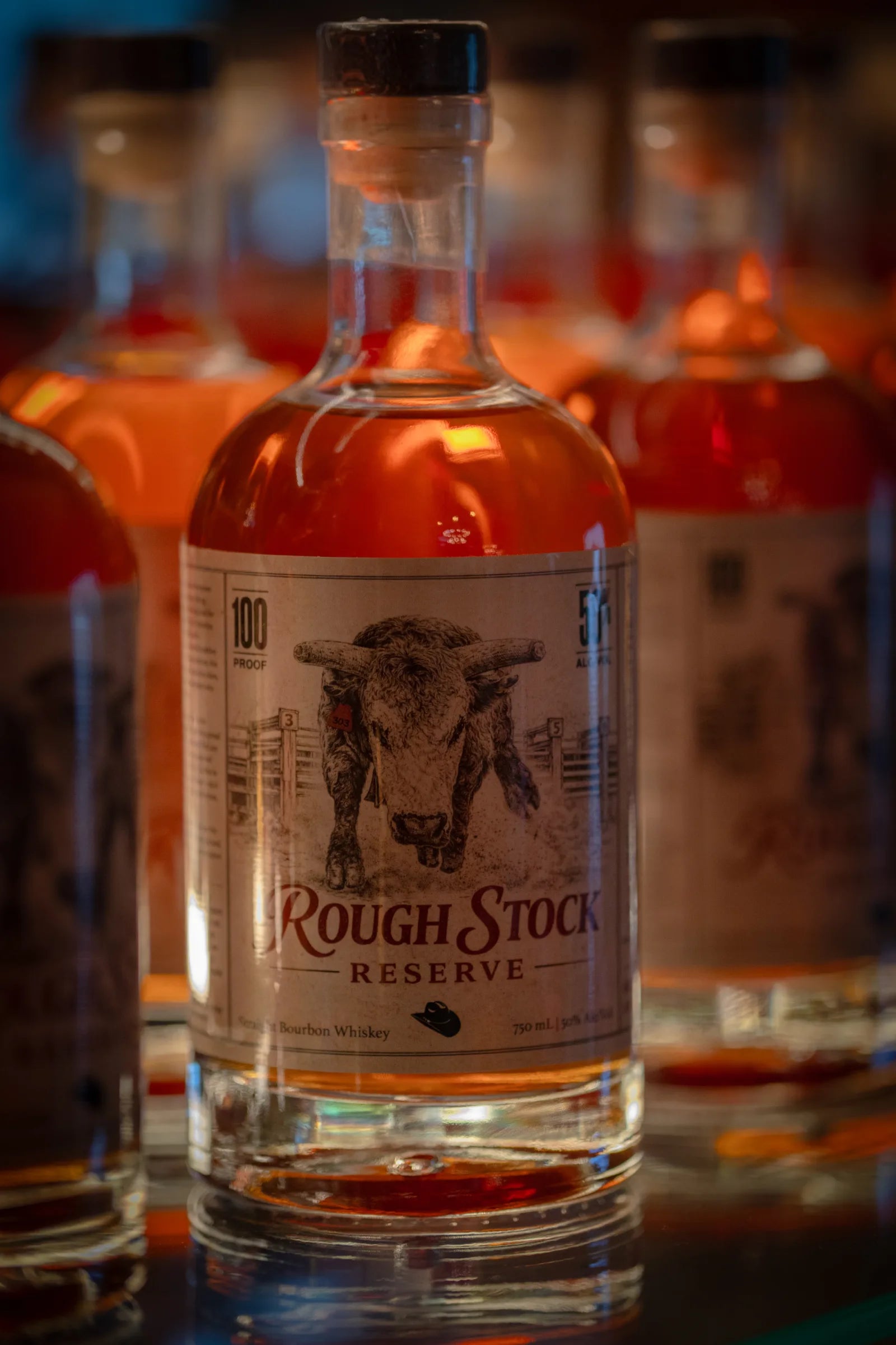 Bottles of Rough Stock Reserve bourbon with the bull-head label