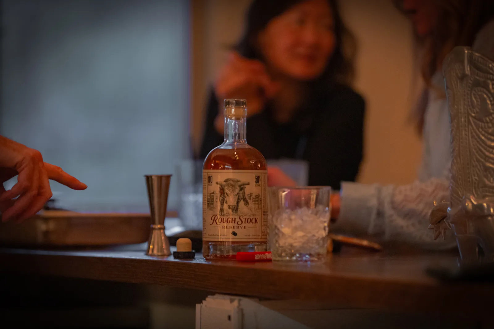 Pouring Rough Stock Reserve bourbon behind the bar