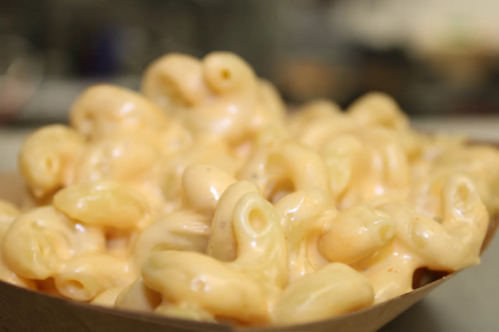 Creamy mac and cheese in a paper boat