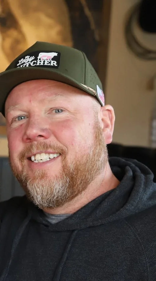 Scott McKenzie, COO of The Lazy Butcher and Black Hat Cattle Co., in a Lazy Butcher cap